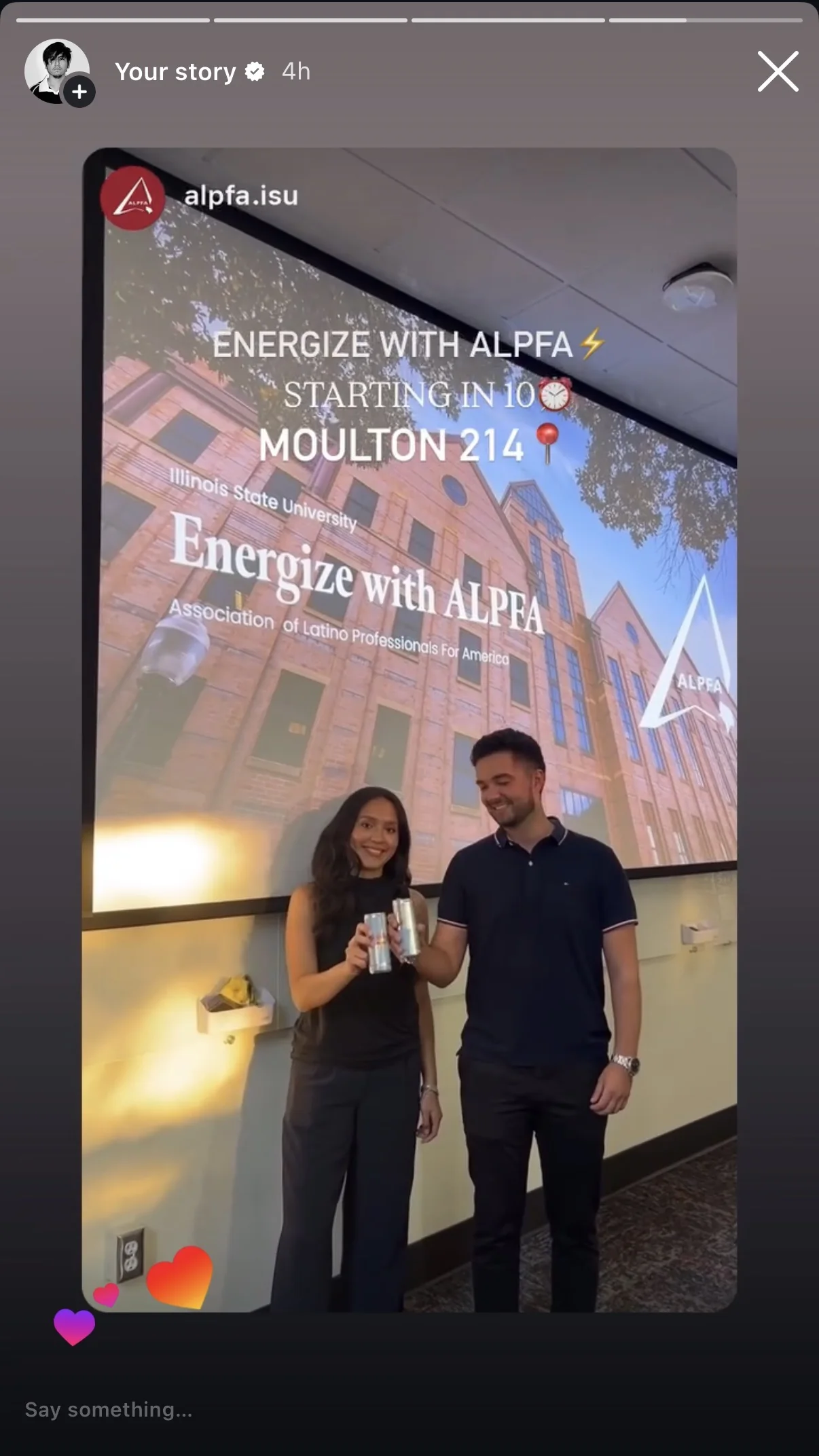 Oscar sharing an @alpfa.isu Instagram story: two members toasting with cans in front of the projected Energize with ALPFA title slide over a photo of a brick campus building, with the text Starting in 10, Moulton 214