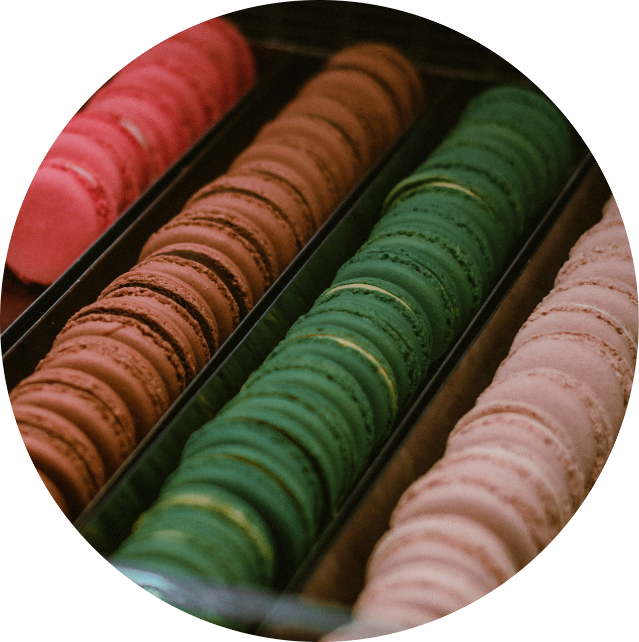 macorons put on display behind a glass case