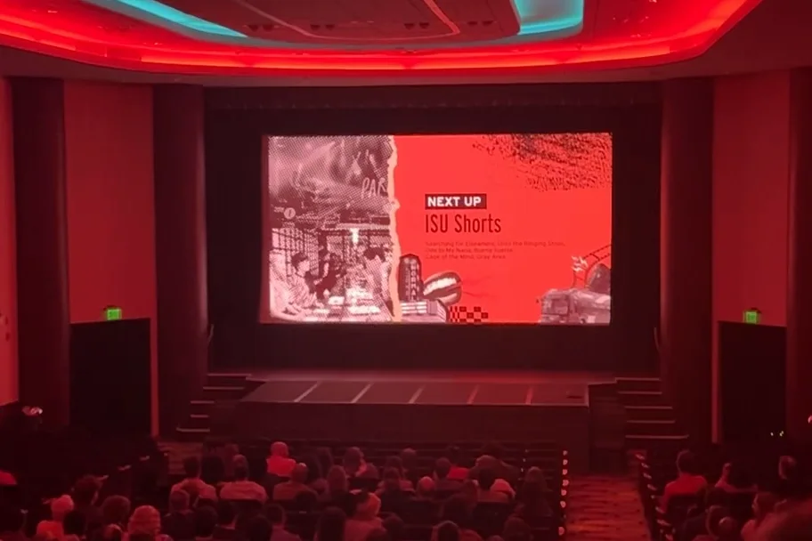 A full Normal Theater audience facing the screen as a Foxtail Film Festival bumper announces the ISU Shorts block